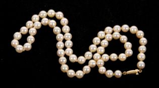 A cultured pearl necklace, the round cultured pearls each approx. 6mm diameter, with clasp stamped