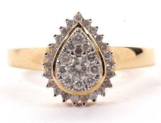 A 9ct pear shape diamond cluster ring, the centre pave set with a yellow gold surround, followed