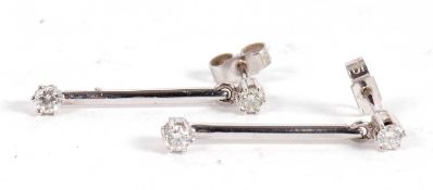 A pair of 9ct white gold and diamond earrings, set with a round brilliant cut to a blade of white