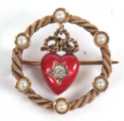 A 15ct red enamel and diamond heart brooch, the central red enamel heart set to centre with an old