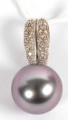 An 18kt black cultured pearl and diamond pendant, the round black cultured pearl, approx. 15.3mm