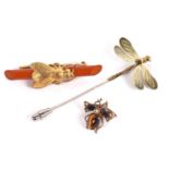 Three insect brooches: to include an enamelled dragonfly stick pin, a faux amber and gilt metal
