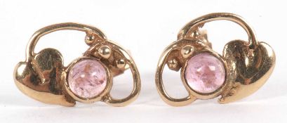 A pair of 9ct tourmaline earrings, the Art Nouveau styled earrings each set with a round pink