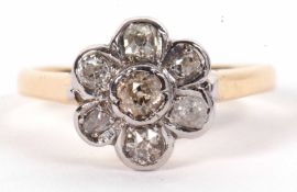 An 18ct diamond flowerhead cluster ring, set with old mine diamonds, total weight of diamonds