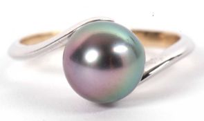 A black cultured pearl ring, the round black cultured pearl, approx. 10mm diameter, set to a plain