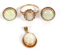 A matched suite of 9ct opal jewellery, to include an oval opal cabochon ring, size Q, hallmarked