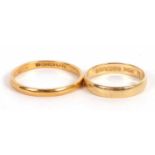 Two gold rings: a 22ct wedding band, London 1952, size W, 3.9g, and an 18ct wedding band, size P,