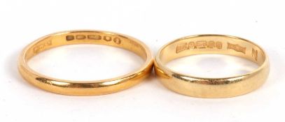 Two gold rings: a 22ct wedding band, London 1952, size W, 3.9g, and an 18ct wedding band, size P,