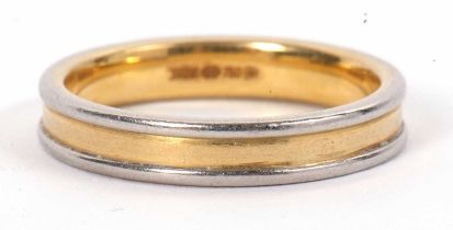 A bi-colour 18ct gold ring, 4mm wide, stamped 750 with Sheffield assay mark, size R, 6.6g