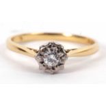 An 18ct diamond solitaire ring, the illusion mounted round brilliant cut diamond with plain band