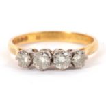 A 22ct four stone diamond ring, the four round brilliant cut diamonds, total estimated approx. 0.