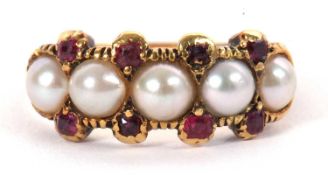 A split pearl and garnet ring, the five split pearls set with small round garnets above and below,