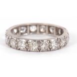 An unmarked diamond eternity ring, set throughout with old European cut diamonds, one stone loose (