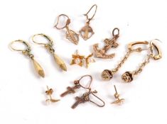 A mixed lot to include a pair of 9ct cultured pearl earrings, pairs of 9ct cross earrings, a 9ct