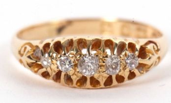 An 18ct diamond ring, the five graduated old cut diamonds, claw mounted with tapered shoulders and