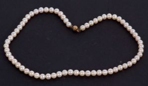 A cultured pearl necklace, the uniform round cultured pearls, each approx. 7mm diameter,with ball