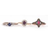 Three gemset rings: to include a 9ct red stone ring; a 9ct amethsyt and CZ ring; and a silver blue