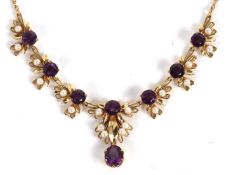 A 9ct amethyst and cultured pearl necklace, set with six round amethysts, claw mounted to loops of