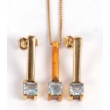 A 9ct topaz pendant and matching earrings, the square topaz, claw mounted to a plain bar of unmarked