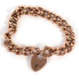 A 9ct curblink bracelet, each link indistinctly stamped 9, with heart shaped padlock clasp