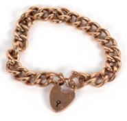 A 9ct curblink bracelet, each link indistinctly stamped 9, with heart shaped padlock clasp