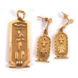 An Egyptian hieroglyphic pendant and similar earrings, the pendant with double sided hieroglyphics