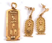 An Egyptian hieroglyphic pendant and similar earrings, the pendant with double sided hieroglyphics