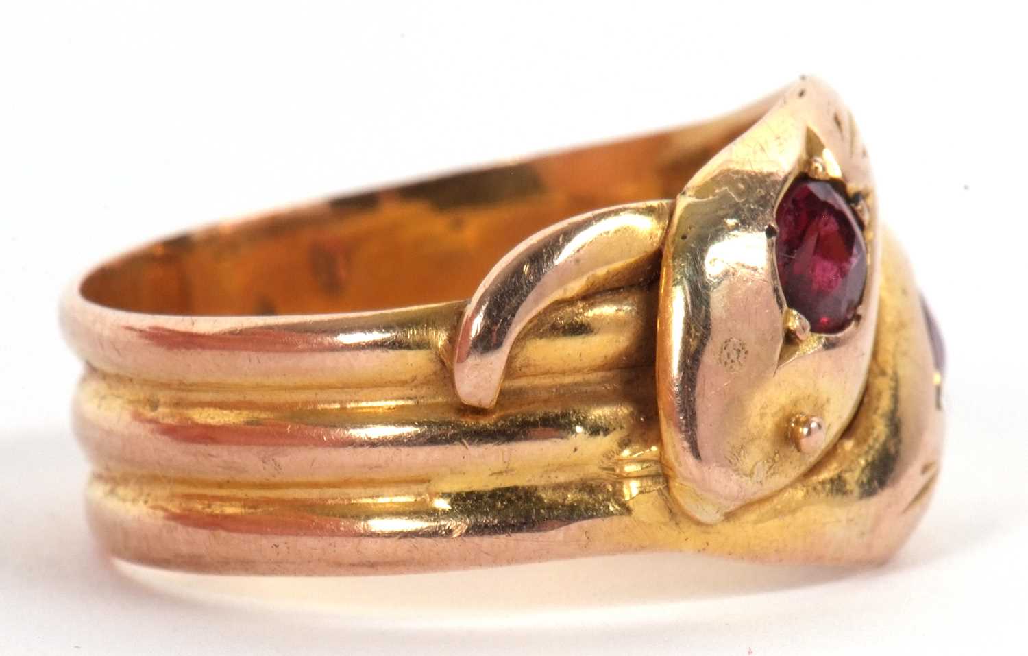 An early 20th century 9ct gemset snake ring, the two snake heads with a red gemstone set to each - Image 5 of 6