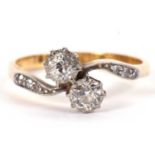 An 18ct 'toi et moi' ring, the round old European cut diamonds, estimated approx. 0.60cts, with