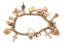 A 9ct curblink charm bracelet, each link stamped 375 with heart shaped padlock clasp stamped 9ct and