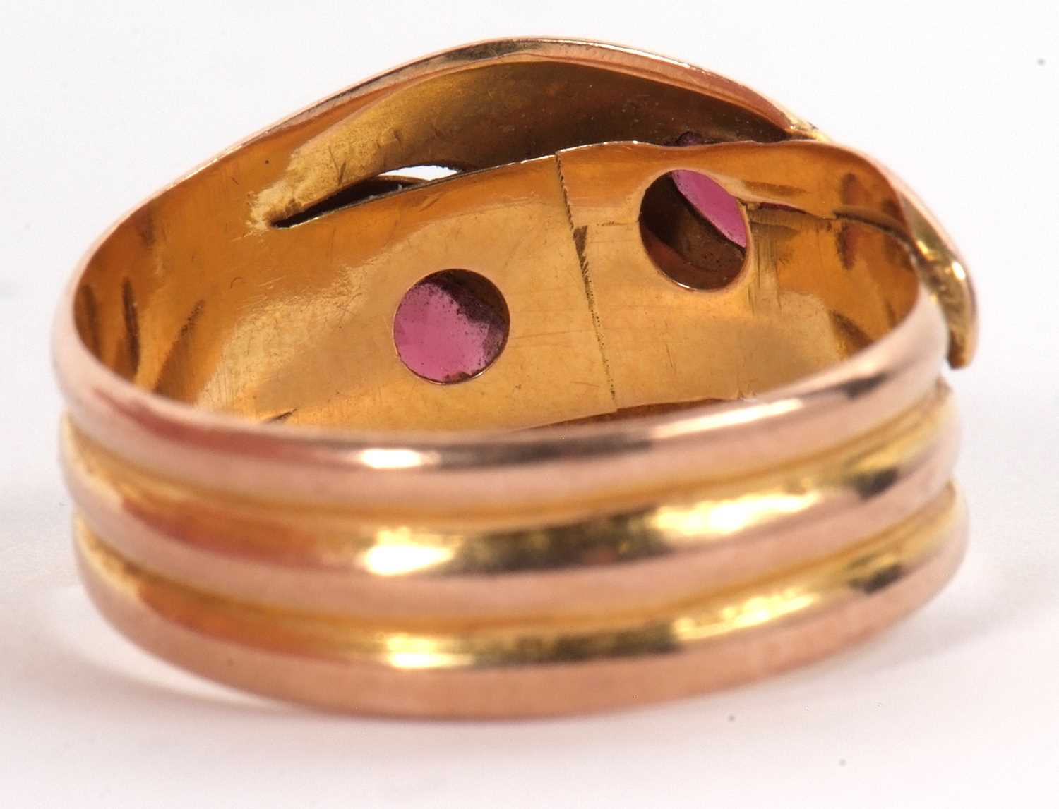 An early 20th century 9ct gemset snake ring, the two snake heads with a red gemstone set to each - Image 4 of 6
