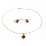 An 18ct green tourmaline necklet and matching earrings, the square green tourmaline cabochon, collet