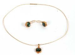 An 18ct green tourmaline necklet and matching earrings, the square green tourmaline cabochon, collet