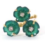 An 18ct green agate and diamond ring, the three carved green agate flowers, each set to centre