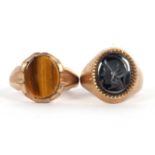 Two 9ct rings: a 9ct hematite intaglio ring, hallmarked London 1971, size J, 5.6g and a 9ct tigers