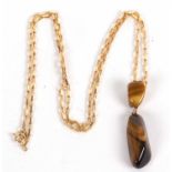 A 9ct tigers eye necklace, the double stone pendant with unmarked yellow metal mounts, 5.1cm long,