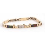 A 14k ammolite and diamond bracelet, set with rectangular panels of ammolite in rubover mounts, with