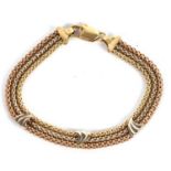 An 18ct tri-colour gold bracelet, the three fancy link strands of yellow, off-white and rose gold,