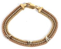An 18ct tri-colour gold bracelet, the three fancy link strands of yellow, off-white and rose gold,