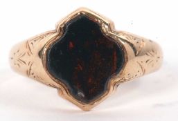 A 9ct bloodstone signet ring, with stylised quatrefoil plain bloodstone, collet mounted with tapered
