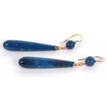 A pair of sodalite drop earrings, the tapered drops with yellow metal caps and suspended from a