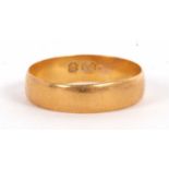 A gold wedding band, hallmarked Birmingham 1898, (other marks worn, tests as approx. 18ct gold),