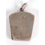 A late 19th/early 20th century silver locket of cricketing interest, the tapered rectangular