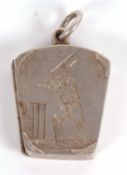A late 19th/early 20th century silver locket of cricketing interest, the tapered rectangular