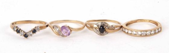 Four 9ct gemset rings, to include a 9ct sapphire and white stone ring, an amethyst ring, a