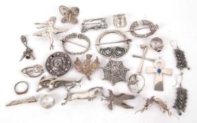 A group of mixed silver brooches to include two pennanular brooches by Robert Allinson, a round