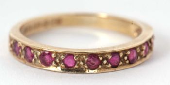A 9ct ruby half hoop ring, the upper half set with small round rubies, with plain lower band