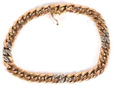 A gold and diamond highlight bracelet, the two tone curblink bracelet set with small sections of