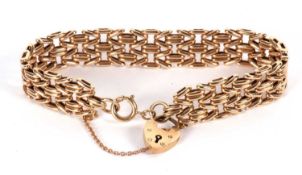 A 9ct gold bracelet, the fancy link bracelet, 14mm wide, stamped 375 to each end, with heart shape