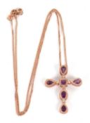 A 9ct Clogau rose gold, amethyst and diamond cross necklace, the cross set with oval, square and